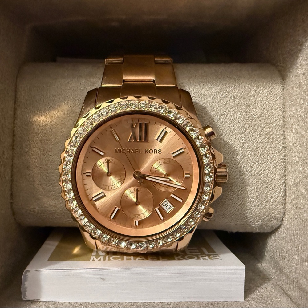 Michael Kors women’s rose gold watch.